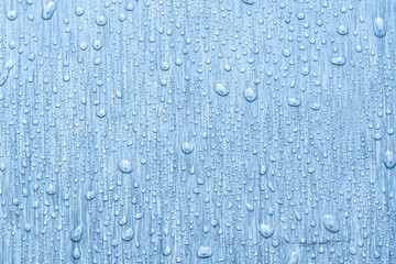 Water drops on metal, blue background. May used as background