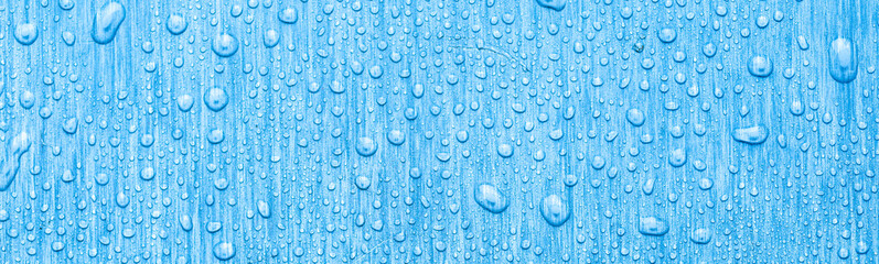 Water drops on metal, blue background. May used as background