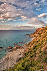Fototapeta na wymiar Coast of Calabria with azure sea and beautiful beaches in Vibo Valentia, Calabria, Southern Italy