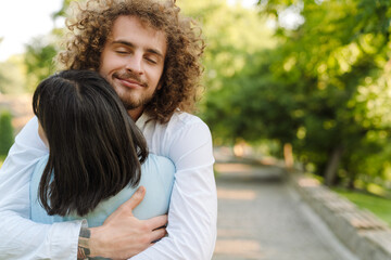 Fototapeta premium Happy young multiethnic couple in park