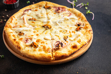 pizza seafood mussels, shrimps, rapana, octopus, scallop, cheese fast food fresh meal snack on the table copy space food background rustic 