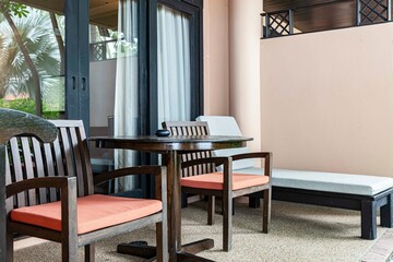 Brown wooden chairs and brown wood table on the balcony