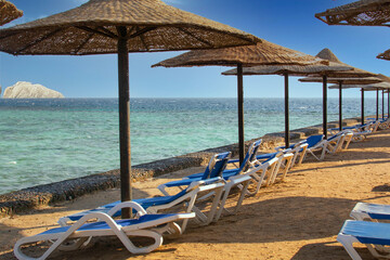 View of the beach with umbrellas and sun beds , the red sea, Hurghada, Egypt