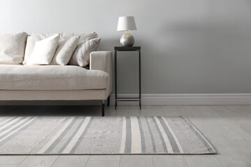 Living room interior with comfortable sofa and stylish rug