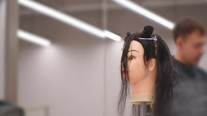 hairdressing courses student training on a manikin wig
