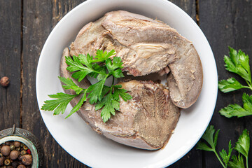 pork tongue cooked meat boiled fresh portion ready to eat meal snack on the table copy space food background rustic. top view keto or paleo diet