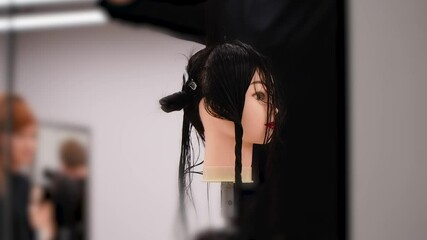 hairdressing courses student training on a manikin wig