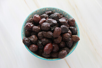 black round buttery olives with a stone