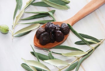 black round buttery olives with a stone