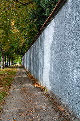 Walking along the walls of champagne house in old French city Reims in August, France