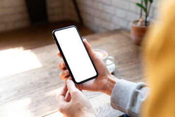 cell phone blank white screen mockup.woman hand holding texting using mobile on desk at office.background empty space for advertise.work people contact marketing business,technology
