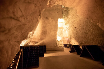 Deep and long undergrounds caves for making champagne sparkling wine from chardonnay and pinor noir...