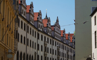 Beautiful historic antique buildings in Munich Muenchen Old Town Downtown Marienplatz area with...