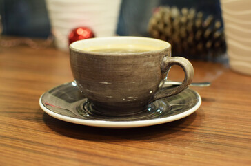Beautiful ceramic cup with tea in a cafe