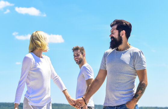 Lucky you. Happy for you. Couple in love and passing by man. Happy relations. Strong feelings. Confident in her choice. True love. Love date concept. Lovely couple holding hands. Forever together