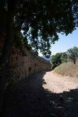 Walking on ancient french village Grimaud, touristic destination with ruines fortress castle on top, Var, Provence, France