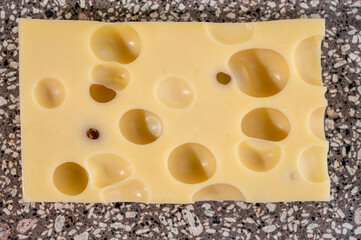 Cheese collection, semi-hard French cheese emmentaler with round holes made from cow milk