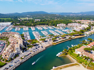 Fototapeta na wymiar Aerial view on small houses and sailboats of Port Grimaud and port Cogolin, French Riviera, Provence, France
