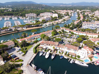 Aerial view on small houses and sailboats of Port Grimaud and port Cogolin, French Riviera,...