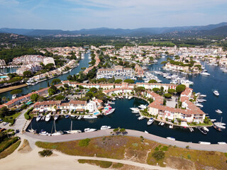 Aerial view on small houses and sailboats of Port Grimaud and port Cogolin, French Riviera, Provence, France