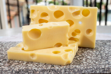 Cheese collection, semi-hard French cheese emmentaler with round holes made from cow milk