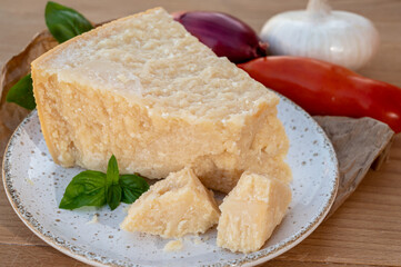 Cheese collection, piece of matured cow cheese pasmesan parmigiano reggiano made from cow milk