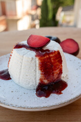 Cheese collection, white Italian soft cheese ricotta served as sweet dessert with homemade plum jam