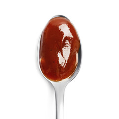 Barbecue sauce in spoon isolated on white background. Close up, top view.