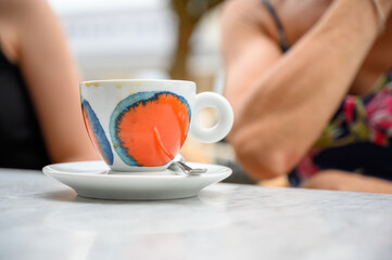 lifestyle cafe society rellaxing having a cup of coffee outside