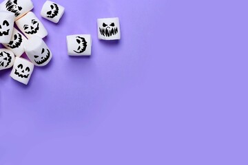 Halloween marshmallows on purple background with Copy space. Flat lay. Top view. Background or texture of white mini marshmallows. Autumn food background concept. Junk unheathy food.