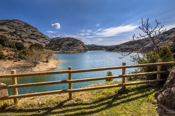 Fototapeta na wymiar View of Vadiello reservoir fence