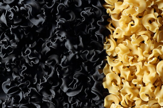 Black and white mafalde pasta background. Squid ink pasta.