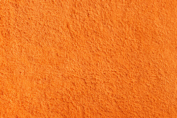 orange background terry towel texture. Soft, fluffy cotton fabric. closeup texture