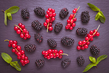 ripe and sweet blackberry and red currant berry and mint leaves