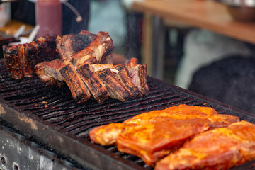 Chef grill barbecue meat and ribs outdoors. BBQ meat