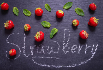 sprinkled ripe berry - strawberry and mint leaves and an inscription