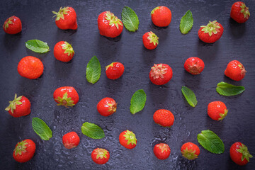 sprinkled ripe berry - strawberry and mint leaves and an inscription on
