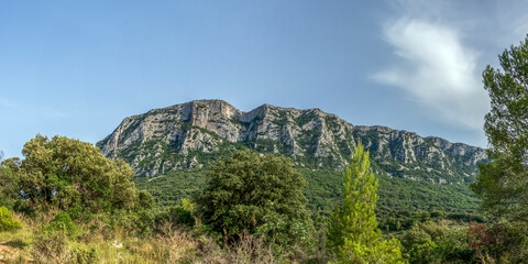 Fototapeta na wymiar Pic Saint-Loup mountain wall in Languedoc-Roussillon, southern France