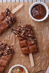 Chocolate ice cream popsicle with nut