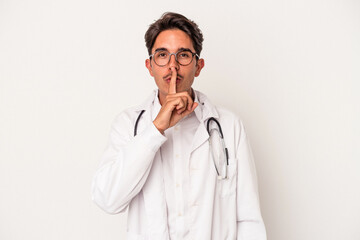 Young mixed race doctor man isolated on white background keeping a secret or asking for silence.