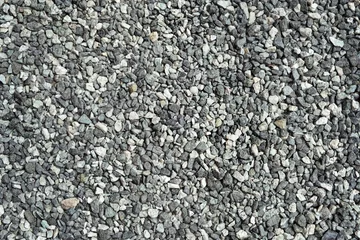 Foto op Canvas gray gravel stones abstract background. Pebble backdrop. crushed stones, construction rocks texture. top view © Ju_see
