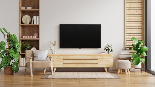 TV cabinet on the white wall in living room with armchair,minimal design.