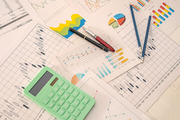 business graphics money calculator pen notebooks lying on the table