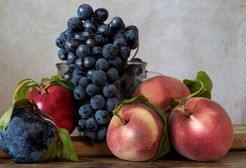 The summer harvest in California is full of aromas, textures and colors. In this still life, I portray three main crops harvested in August in the central portion of the state: wild grapes, peach and 