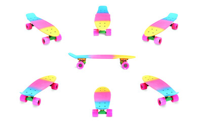 Set of different angles of pastel pink rainbow colored Penny board skateboard isolated on white...