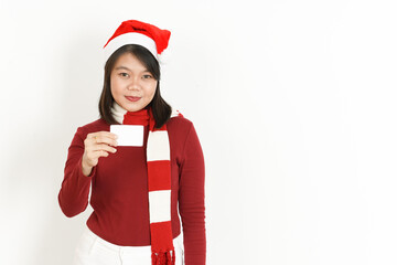 Showing Blank Credit Card of Beautiful Asian Woman Wearing Red Turtleneck and Santa Hat Isolated On White Background