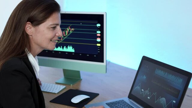 Mature business trader woman working at home doing blockchain research
