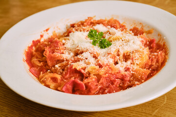 Pumpkin squash with tomato sauce on plate