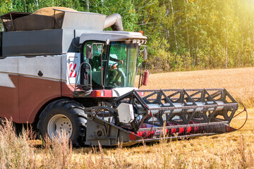 Fototapeta na wymiar Modern combine harvester working in the field