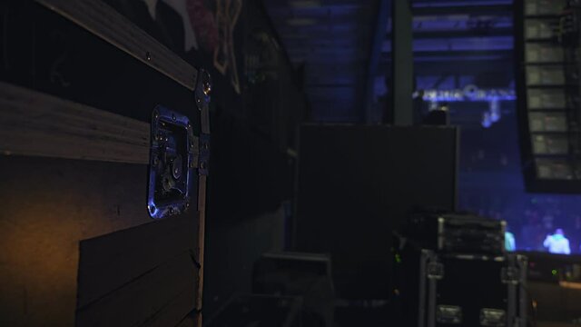 Concert scene with cargo boxes during club party in the dark. Nobody